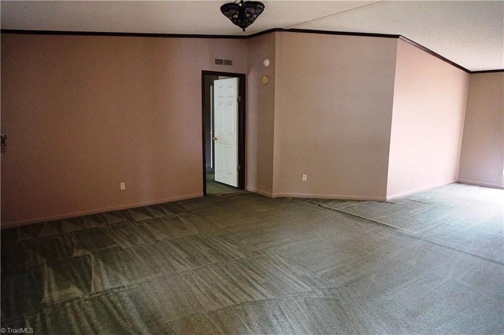 1170 Deer Chase Road Madison, NC 27025 - Photo 2 of 28 LIVING ROOM W/DOOR TO MASTER BEDROOM