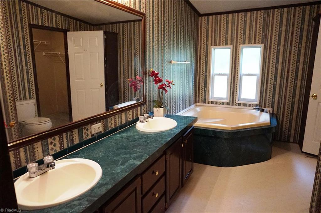 1170 Deer Chase Road Madison, NC 27025 - Photo 22 of 28 MASTER BATH WITH DOUBLE SINKS, GARDEN TUB & SEPARATE SHOWER.