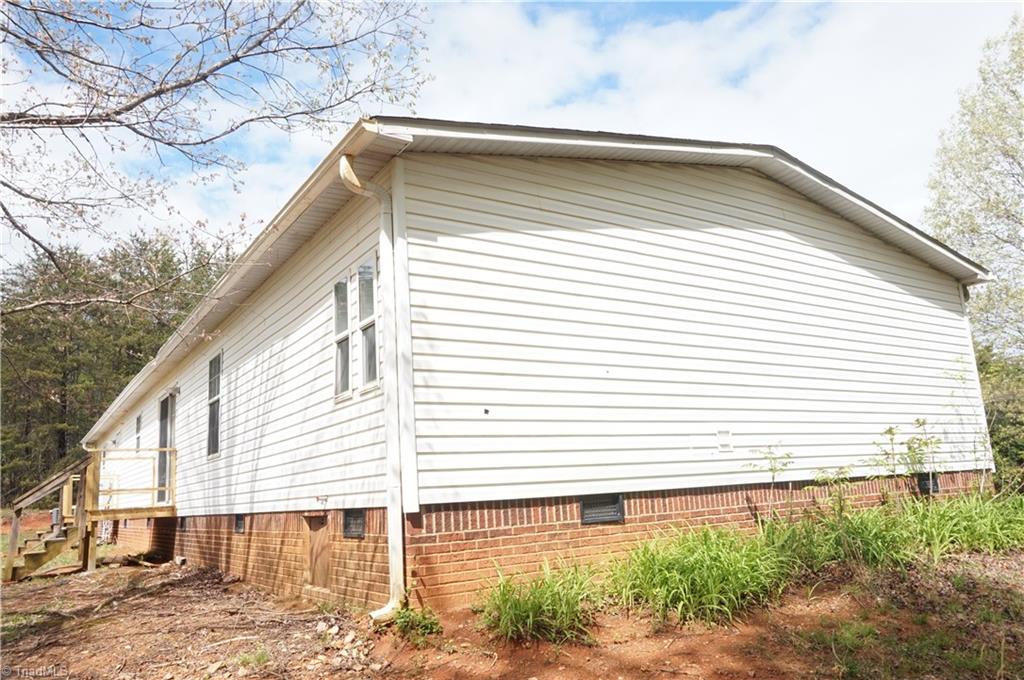 1170 Deer Chase Road Madison, NC 27025 - Photo 25 of 28 BACK LEFT SIDE OF THE HOME