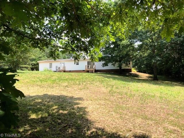 1170 Deer Chase Road Madison, NC 27025 - Photo 26 of 28 View of the huge back-yard, looking at back of the home.