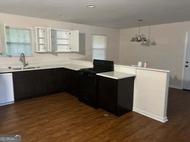 a kitchen with a sink and cabinets