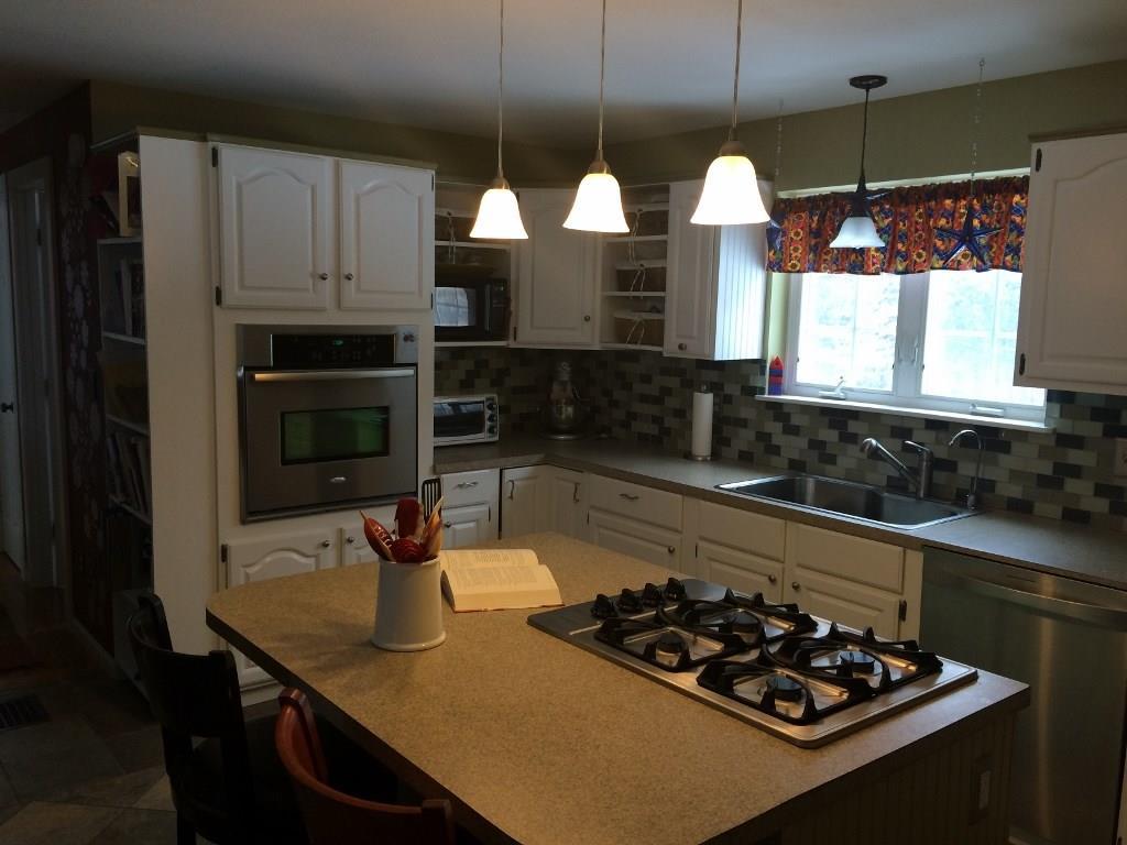 219 Beech Plains Road Buxton, ME 04093 - Photo 11 of 33 Kitchen features a gas cook top and...