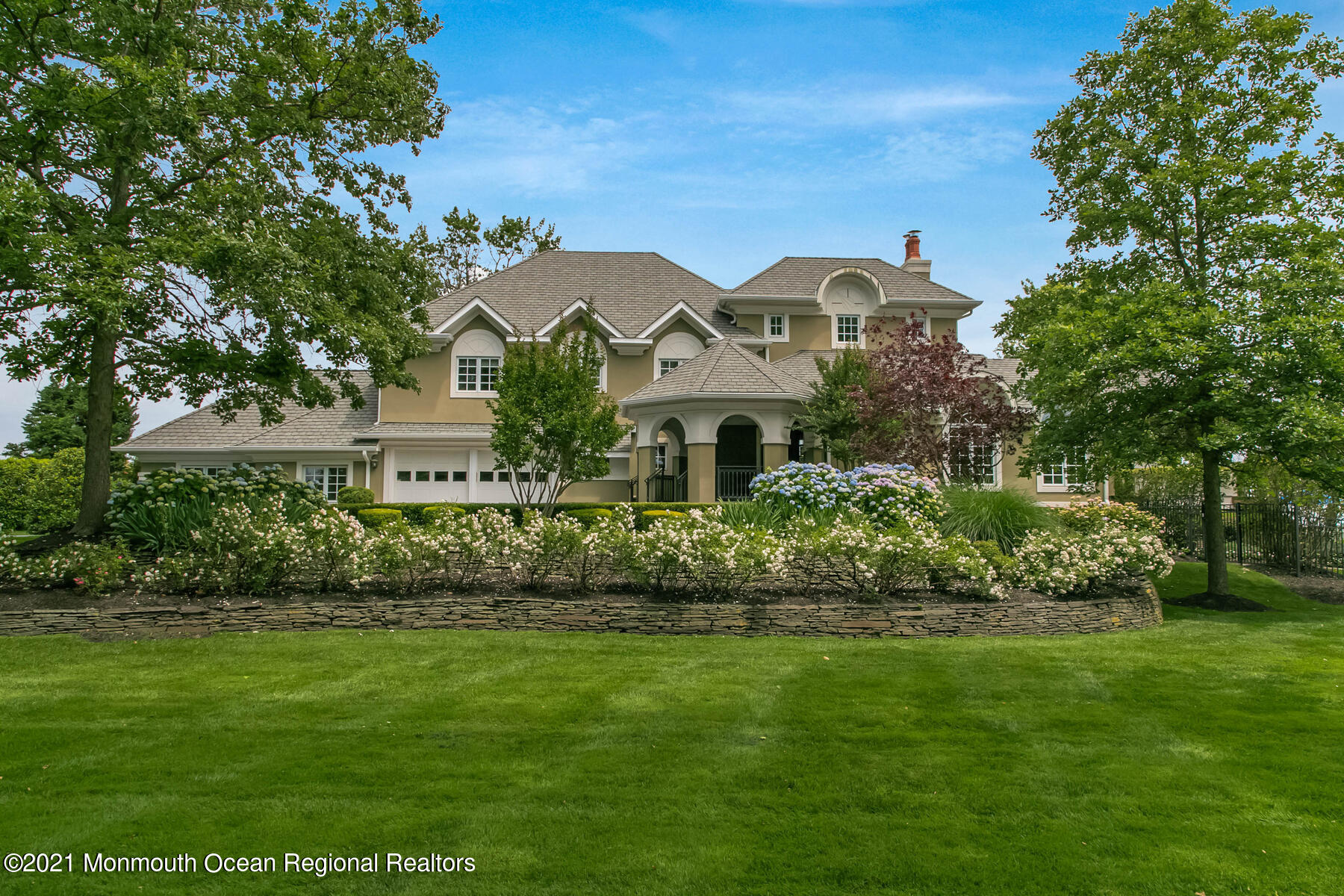 100 Goose Neck Point Road Oceanport, NJ 07757 - Photo 1 of 49 a front view of a house with a garden