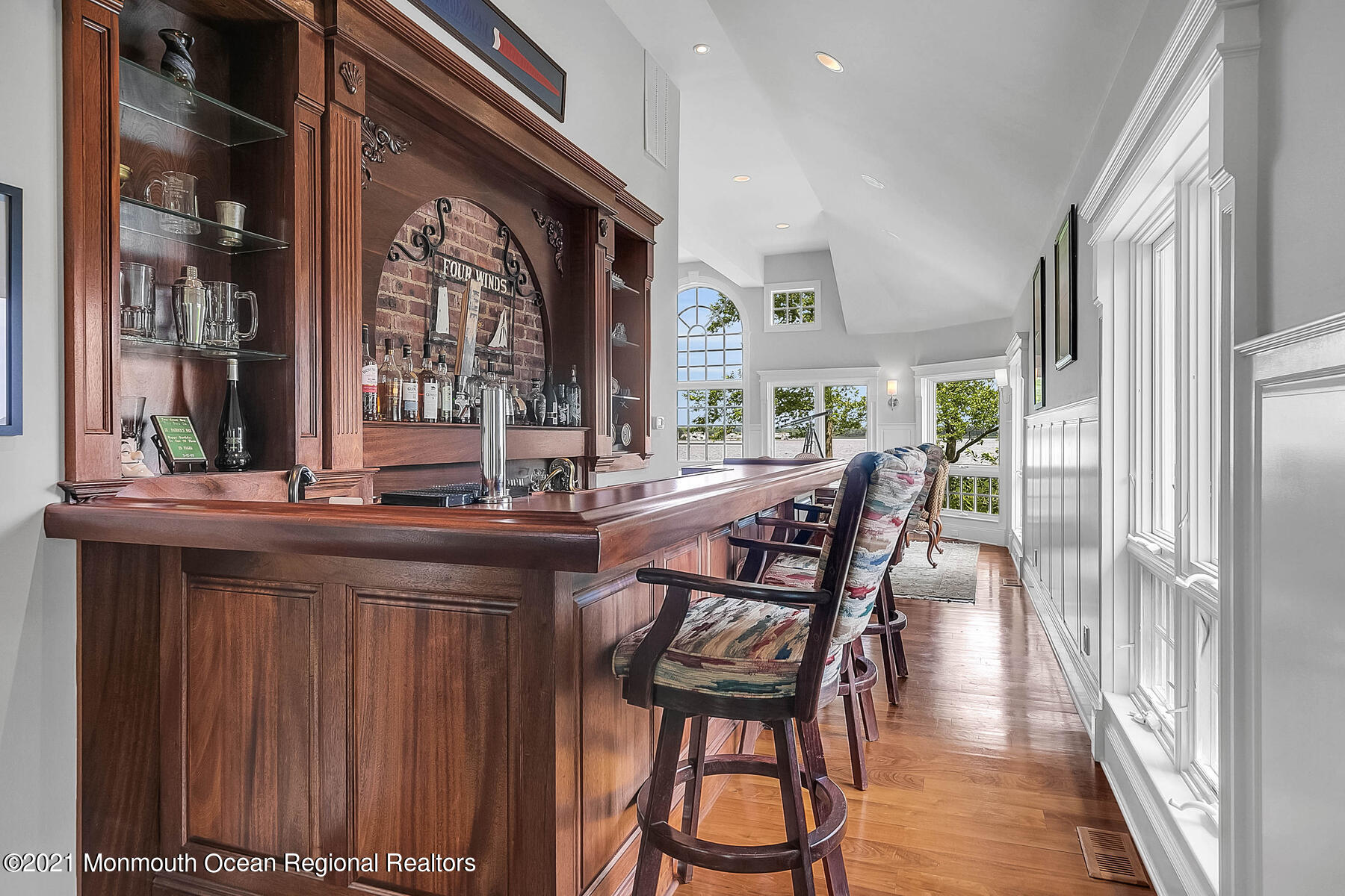 100 Goose Neck Point Road Oceanport, NJ 07757 - Photo 12 of 49 a dining room with wooden floor and large windows