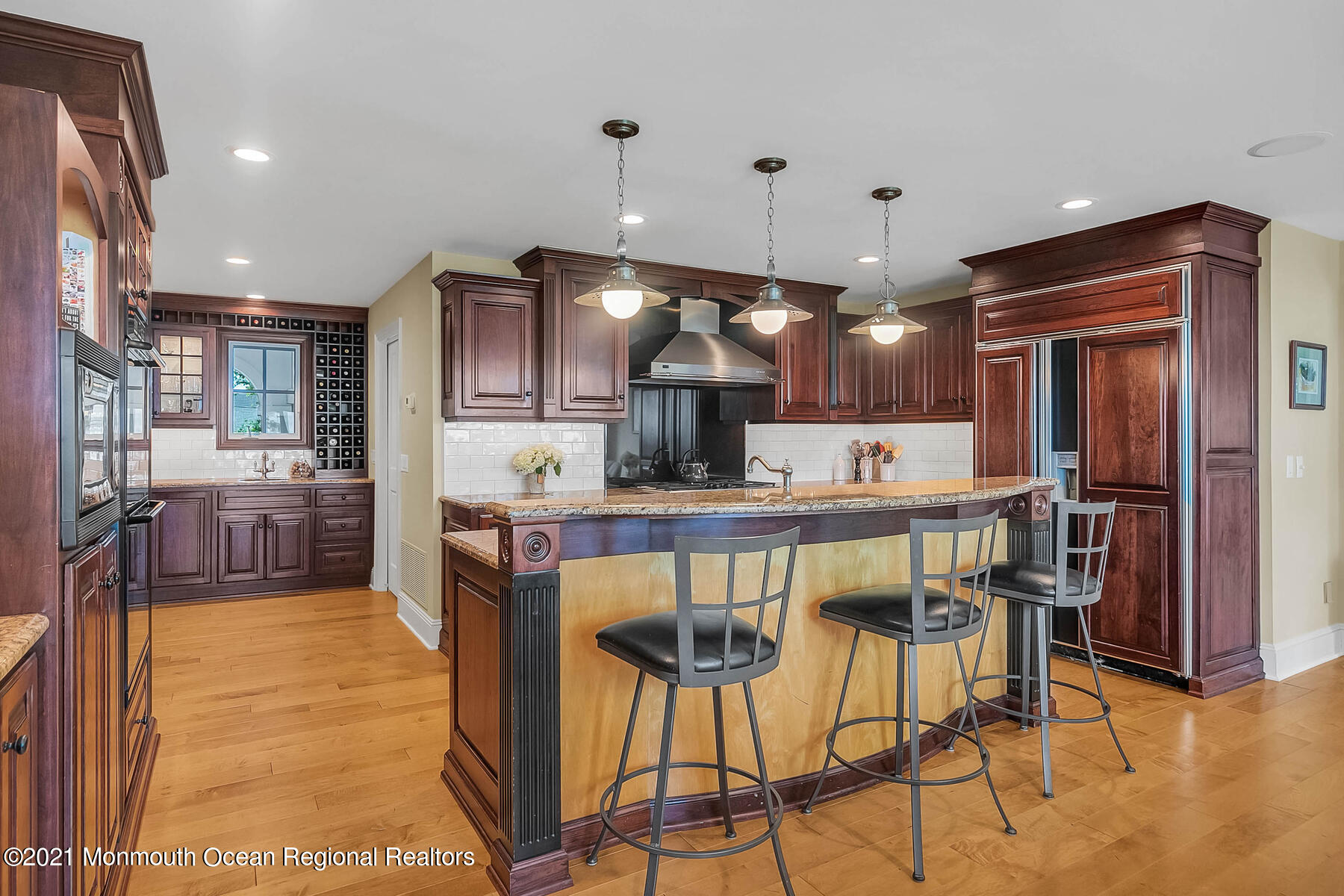 100 Goose Neck Point Road Oceanport, NJ 07757 - Photo 16 of 49 a kitchen with stainless steel appliances kitchen island granite countertop a refrigerator and chairs