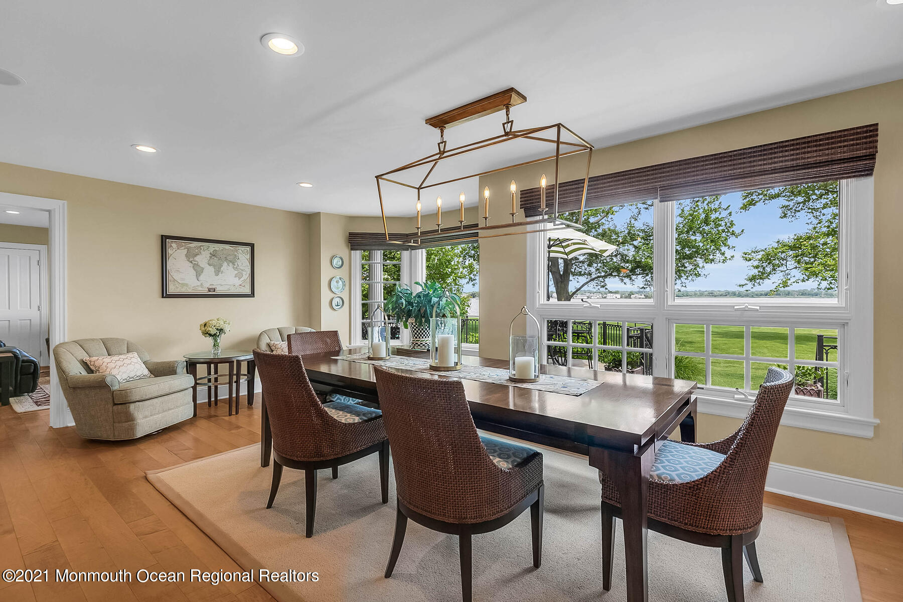 100 Goose Neck Point Road Oceanport, NJ 07757 - Photo 17 of 49 a dining room with furniture a chandelier and wooden floor