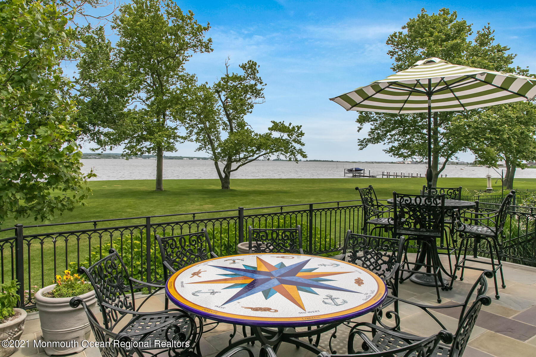 100 Goose Neck Point Road Oceanport, NJ 07757 - Photo 20 of 49 a view of a chairs and table in backyard