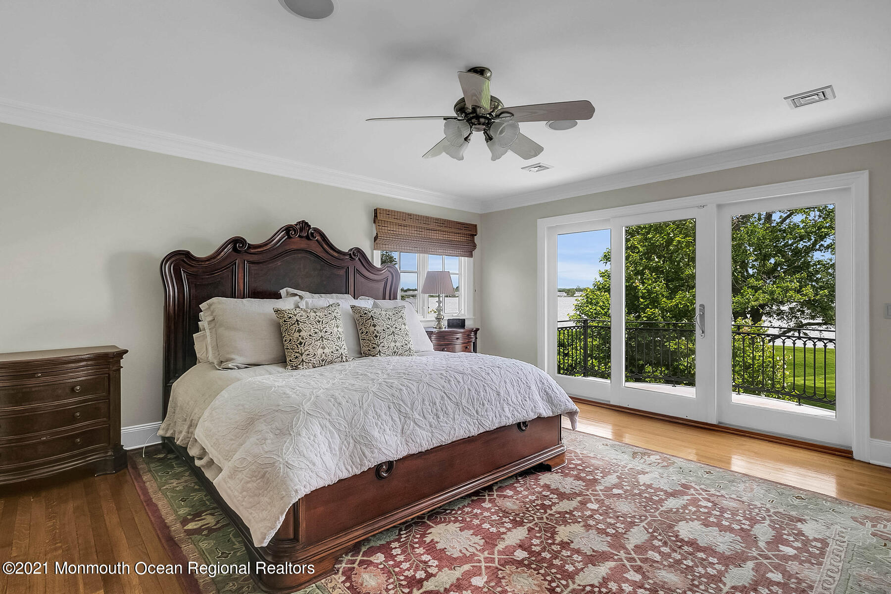 100 Goose Neck Point Road Oceanport, NJ 07757 - Photo 21 of 49 a bedroom with a large bed and a large window