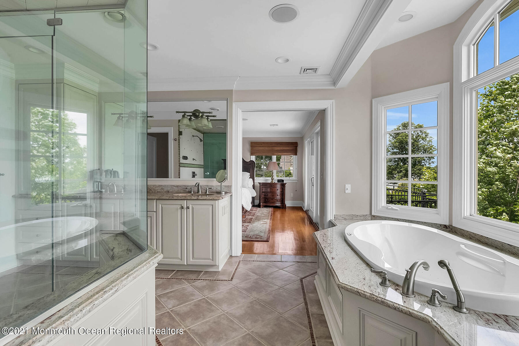 100 Goose Neck Point Road Oceanport, NJ 07757 - Photo 22 of 49 a bathroom with a granite countertop tub sink and glass door