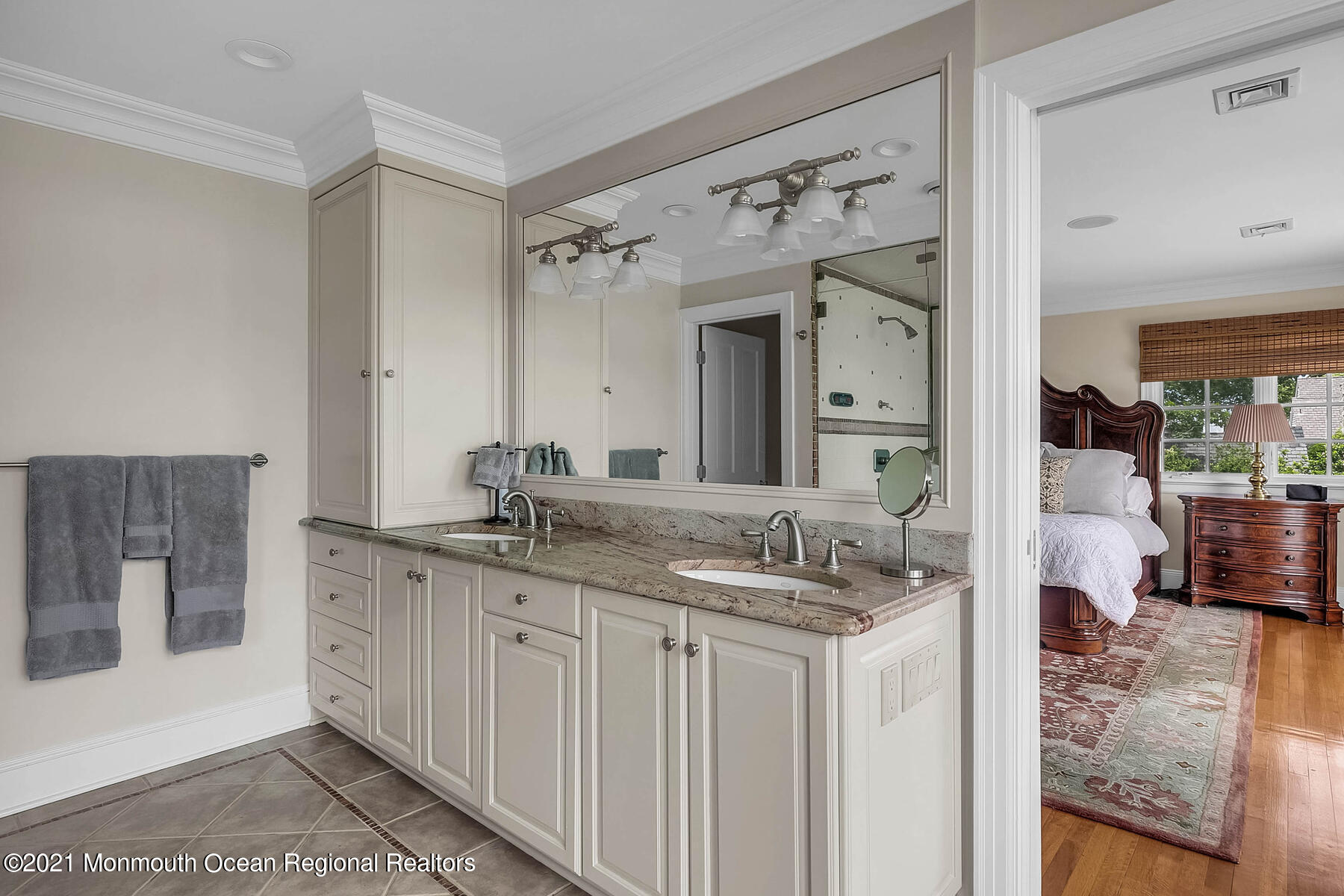 100 Goose Neck Point Road Oceanport, NJ 07757 - Photo 23 of 49 a en suite bathroom with a granite countertop sink and a mirror