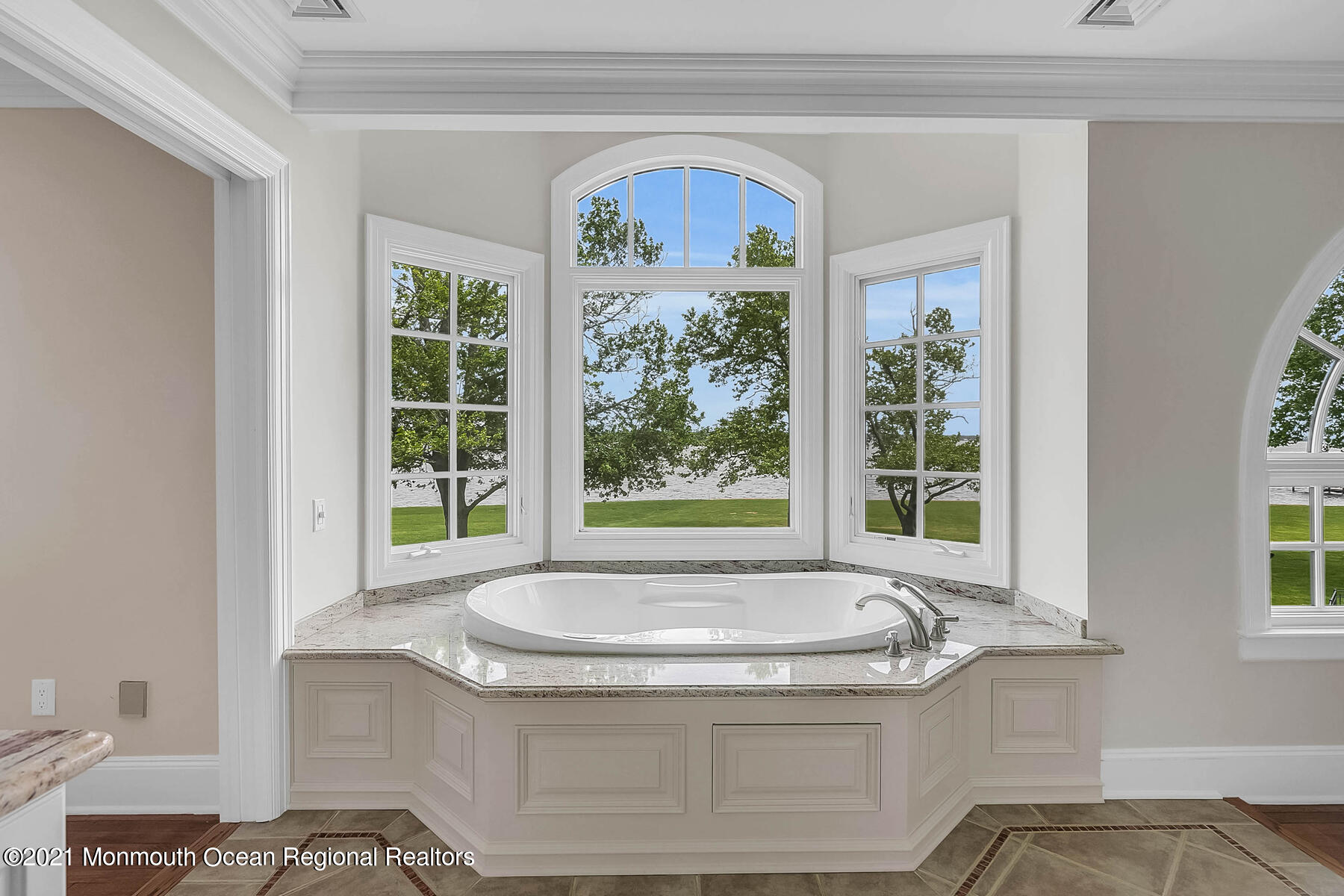 100 Goose Neck Point Road Oceanport, NJ 07757 - Photo 24 of 49 a bath tub sitting in a bathroom next to a window