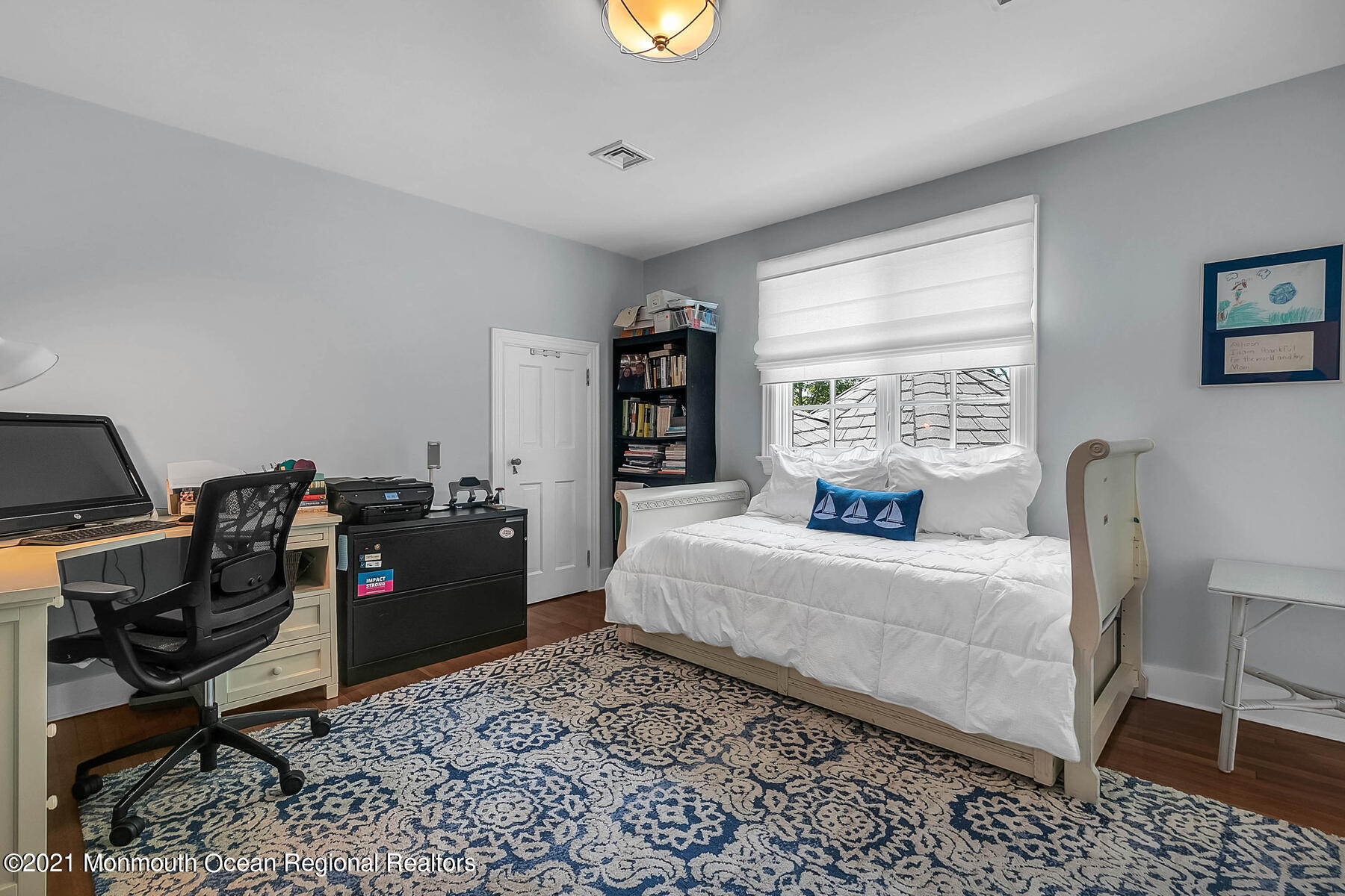 100 Goose Neck Point Road Oceanport, NJ 07757 - Photo 26 of 49 a bedroom with a bed and a bookshelf