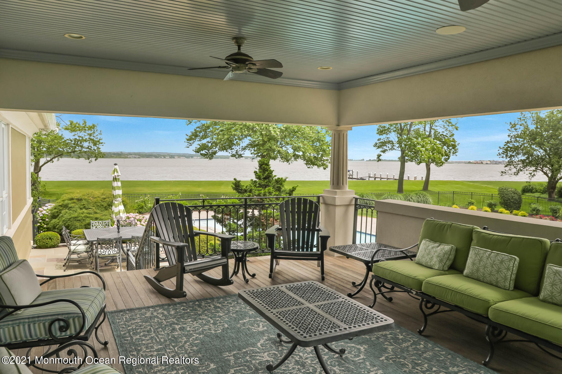 100 Goose Neck Point Road Oceanport, NJ 07757 - Photo 30 of 49 a view of a patio with couches chairs potted plants and a table