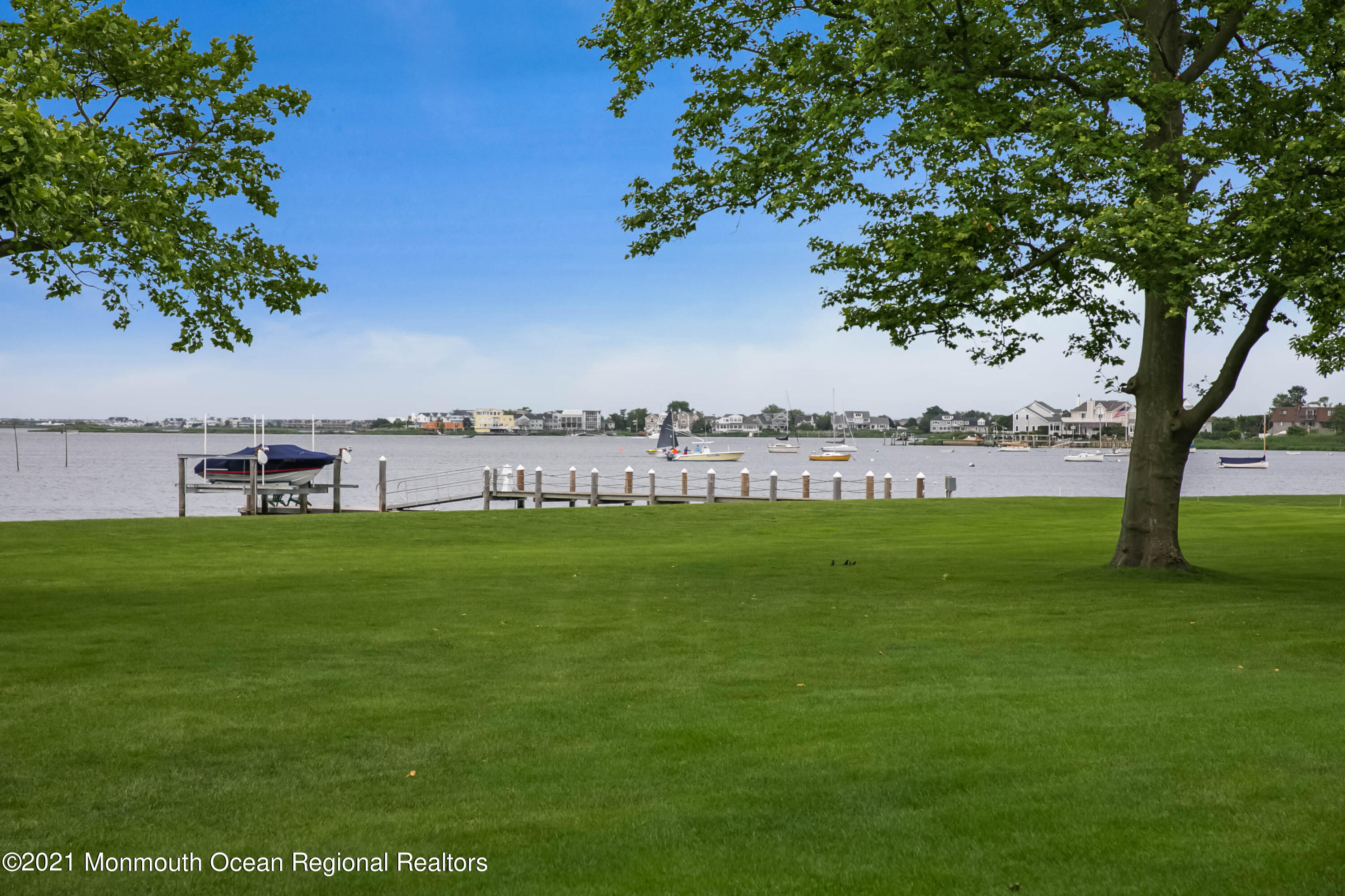 100 Goose Neck Point Road Oceanport, NJ 07757 - Photo 35 of 49 a view of a green field with wooden fence