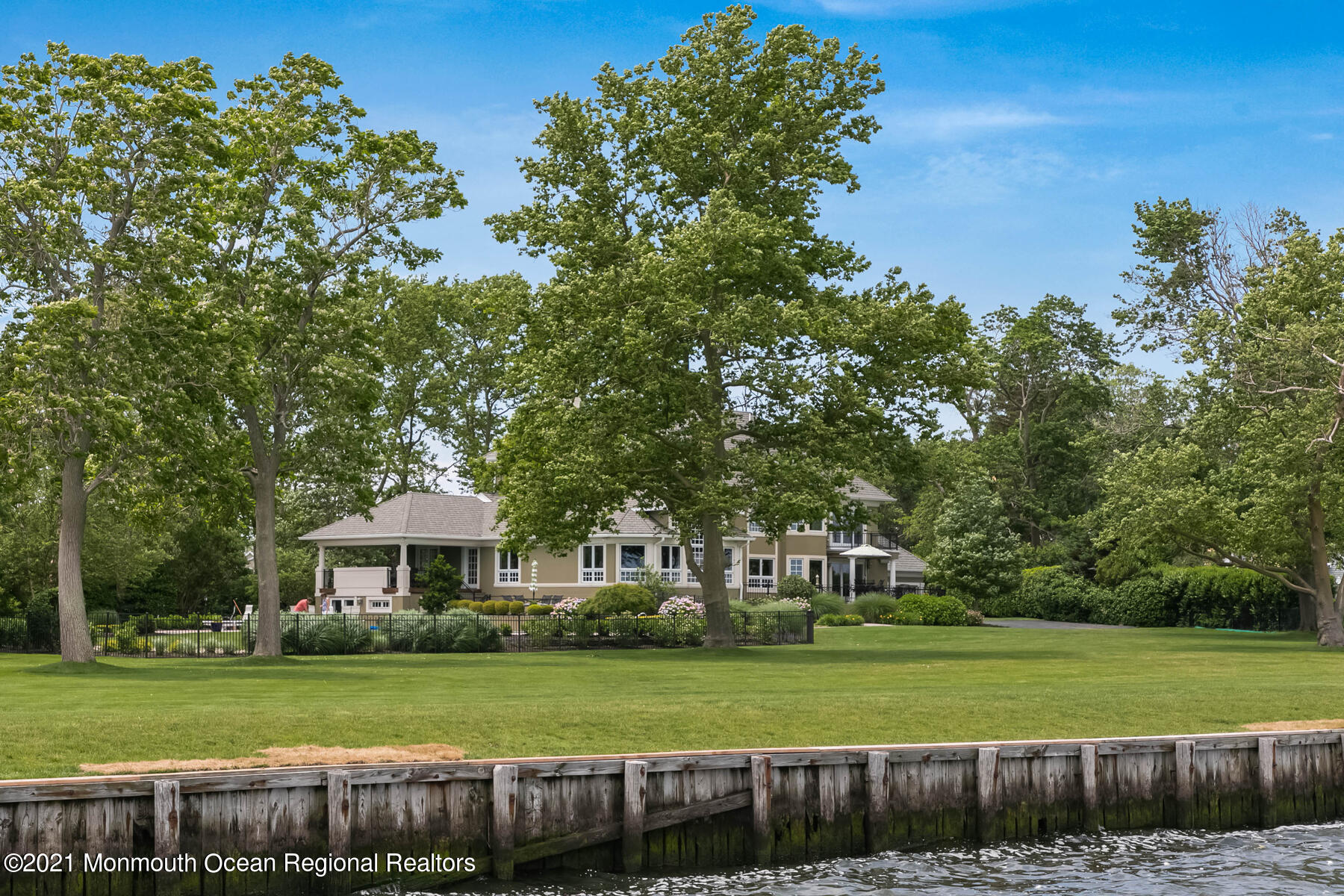 100 Goose Neck Point Road Oceanport, NJ 07757 - Photo 40 of 49 a front view of a house with a garden