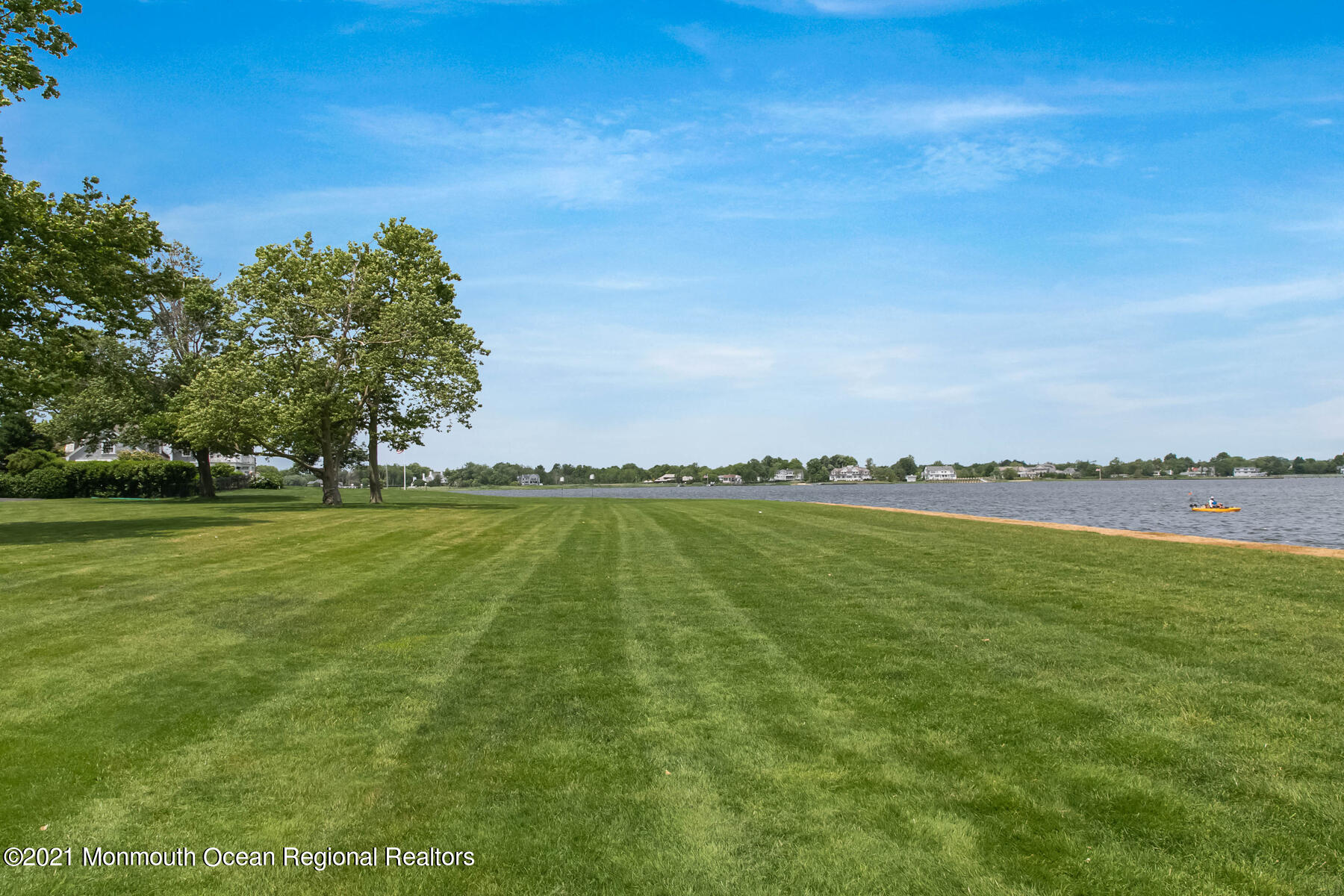 100 Goose Neck Point Road Oceanport, NJ 07757 - Photo 42 of 49 a view of a lake with a yard