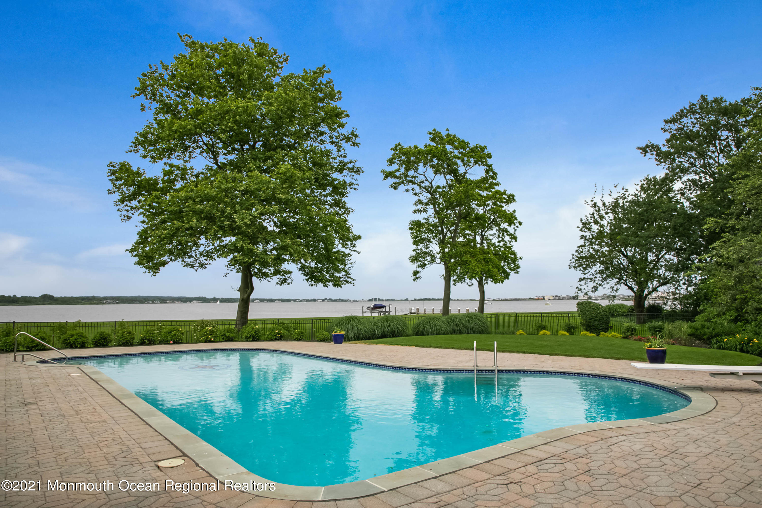 100 Goose Neck Point Road Oceanport, NJ 07757 - Photo 45 of 49 a view of a swimming pool with a yard