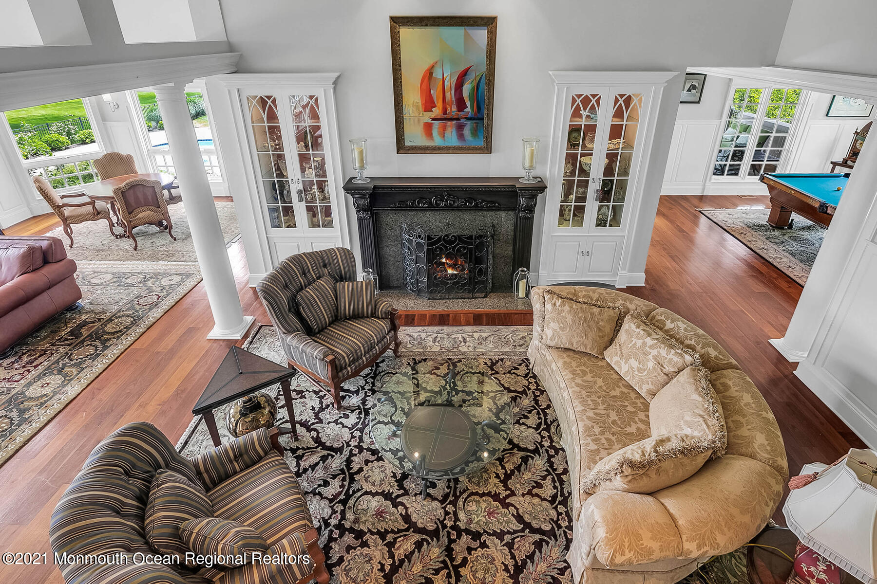 100 Goose Neck Point Road Oceanport, NJ 07757 - Photo 7 of 49 a living room with furniture a fireplace and a large window