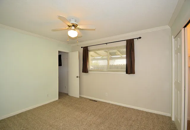 a view of an empty room with a window