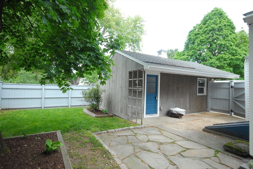 1832 Main Street Concord, MA 01742 - Photo 9 of 25 a front view of a house with garden