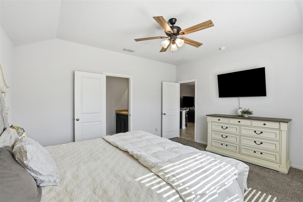 816 Durango Lane Cleburne, TX 76033 - Photo 12 of 16 a bedroom with a bed and a flat screen tv