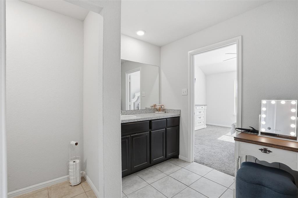 816 Durango Lane Cleburne, TX 76033 - Photo 13 of 16 a bathroom with a sink and a mirror