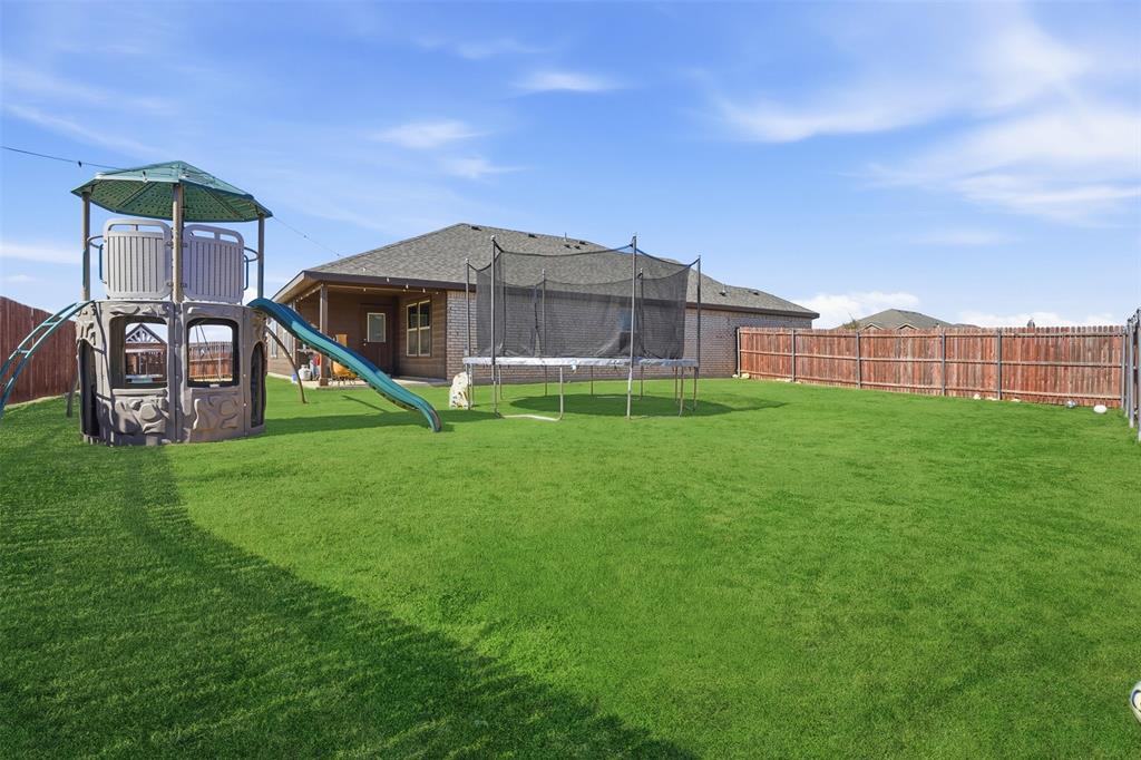 816 Durango Lane Cleburne, TX 76033 - Photo 15 of 16 a view of a house with a yard and sitting area