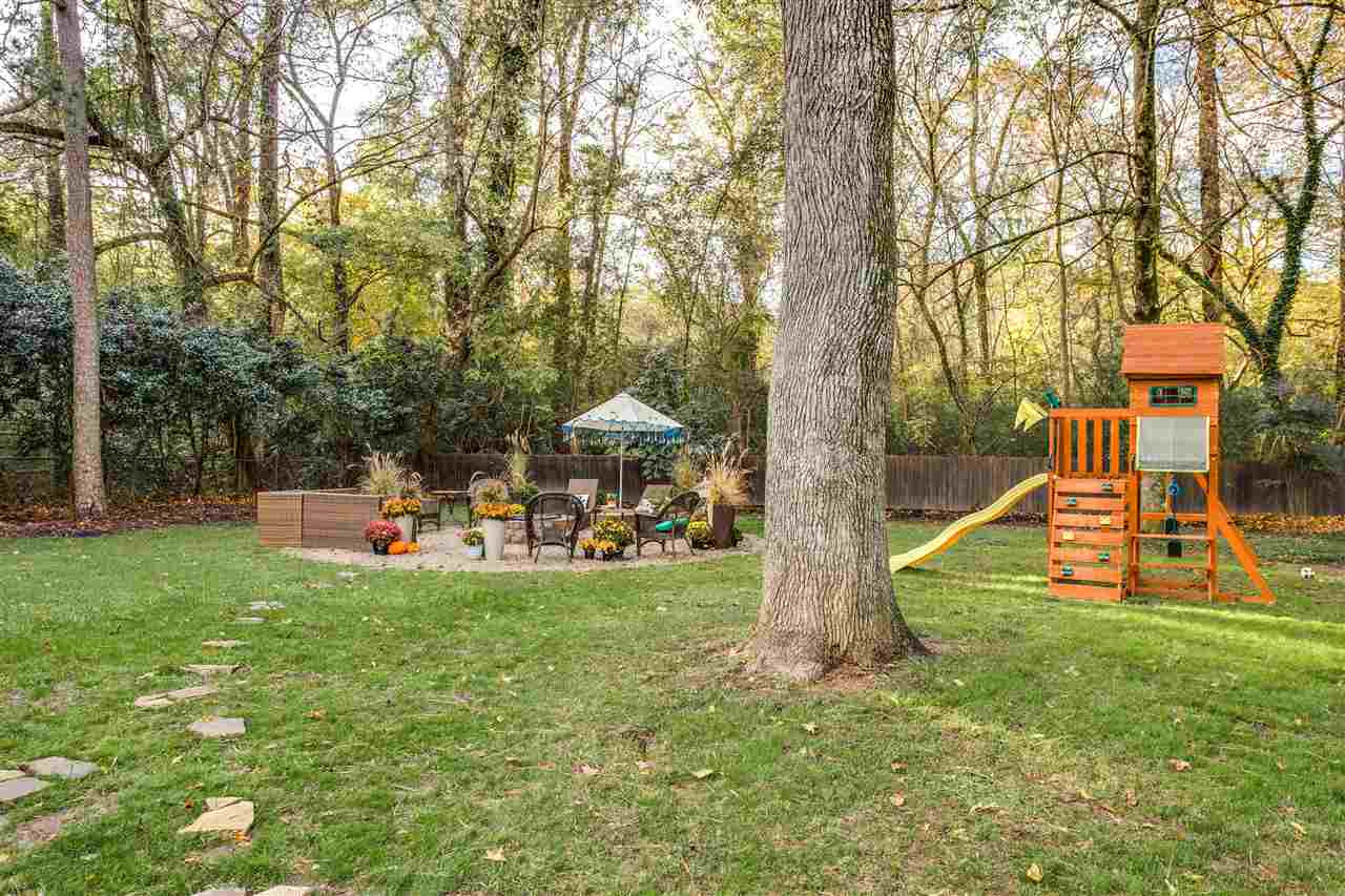 2715 Rothgeb Drive Raleigh, NC 27609 - Photo 20 of 25 BRAND NEW FIREPIT/GRILL AREA JUST INSTALLED. HAS NEVER EVEN BEEN USED! READY AND WAITING FOR THE NEW OWNER. Exterior Back
