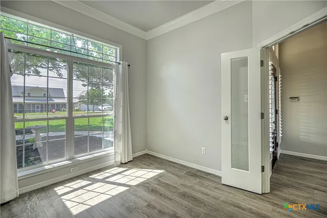 a view of entryway with wooden floor and garden