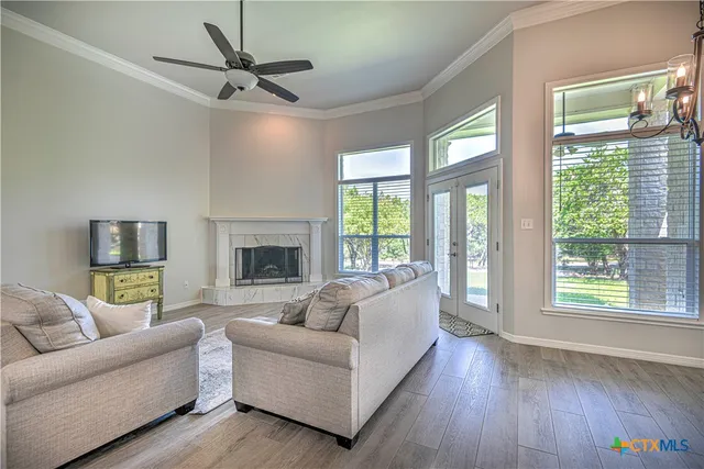 a living room with furniture and a large window