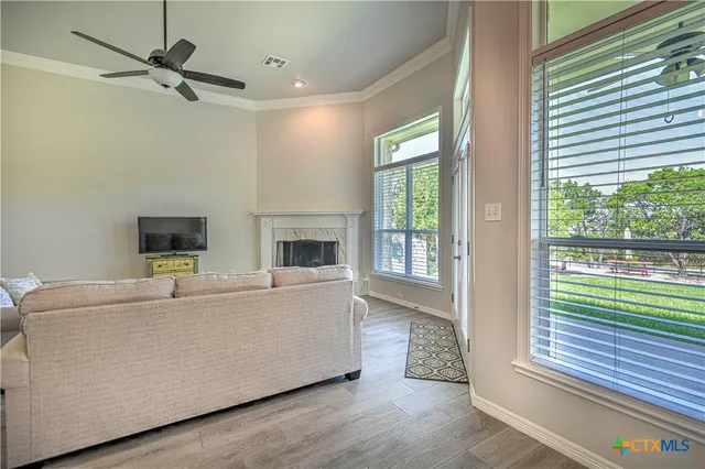 a living room with furniture and a fireplace