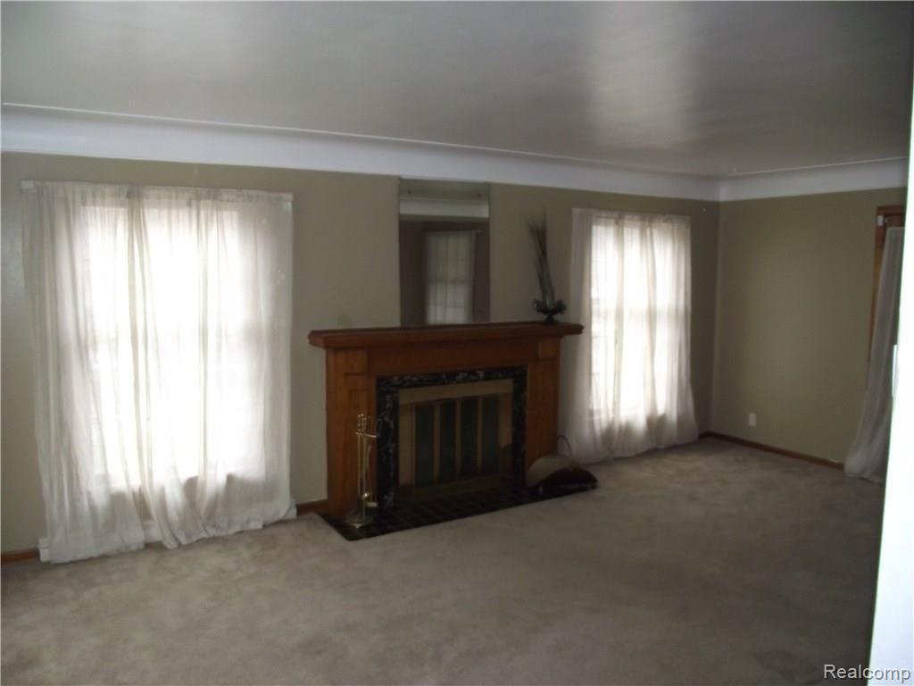 14256 Rutland Street Detroit, MI 48227 - Photo 6 of 27 LIVING ROOM WITH NATURAL FIREPLACE