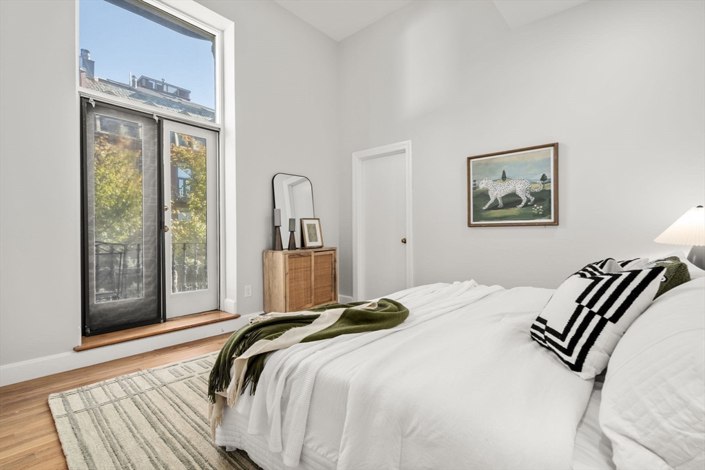 150 Appleton Street, Unit 2A Boston, MA 02116 - Photo 9 of 24 a bedroom with a bed and wooden floor