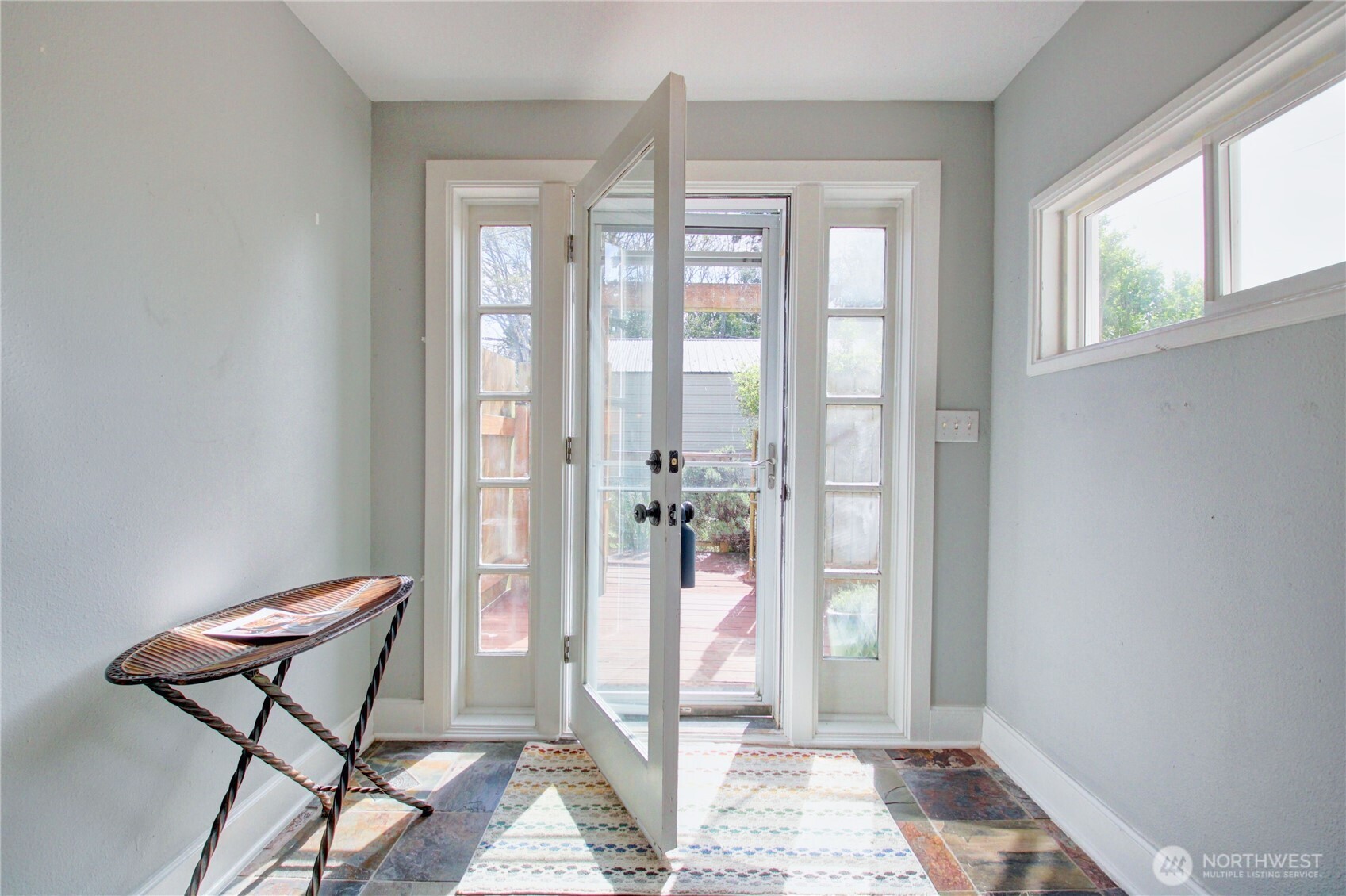 818 Serene View Road Camano Island, WA 98282 - Photo 11 of 39 a view of a room with windows and entryway