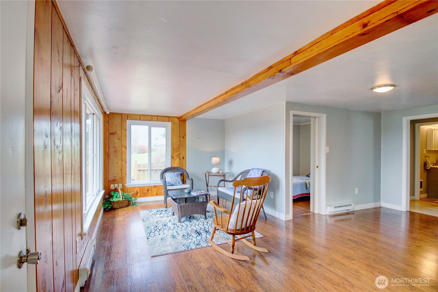 818 Serene View Road Camano Island, WA 98282 - Photo 17 of 39 a view of a livingroom with furniture wooden floor and a window