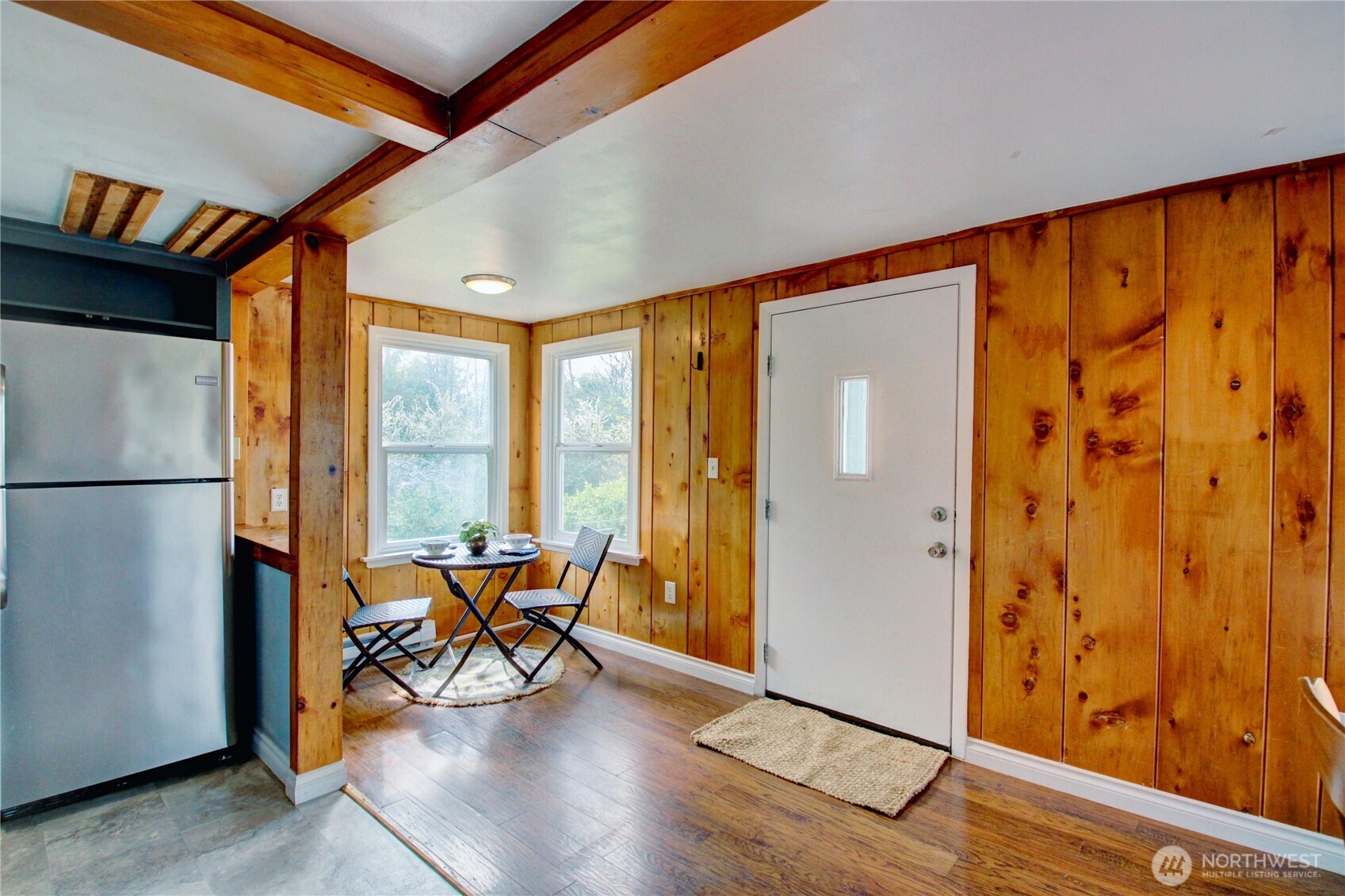 818 Serene View Road Camano Island, WA 98282 - Photo 19 of 39 a view of an empty room and wooden floor and door