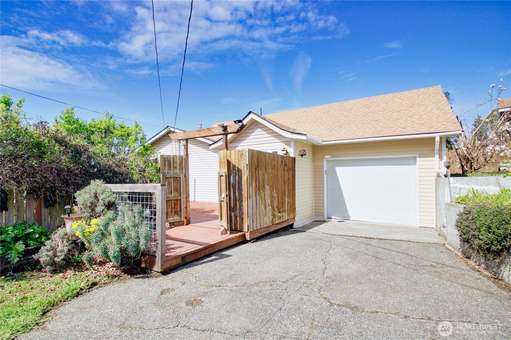 818 Serene View Road Camano Island, WA 98282 - Photo 2 of 39 a view of a house with backyard and garden