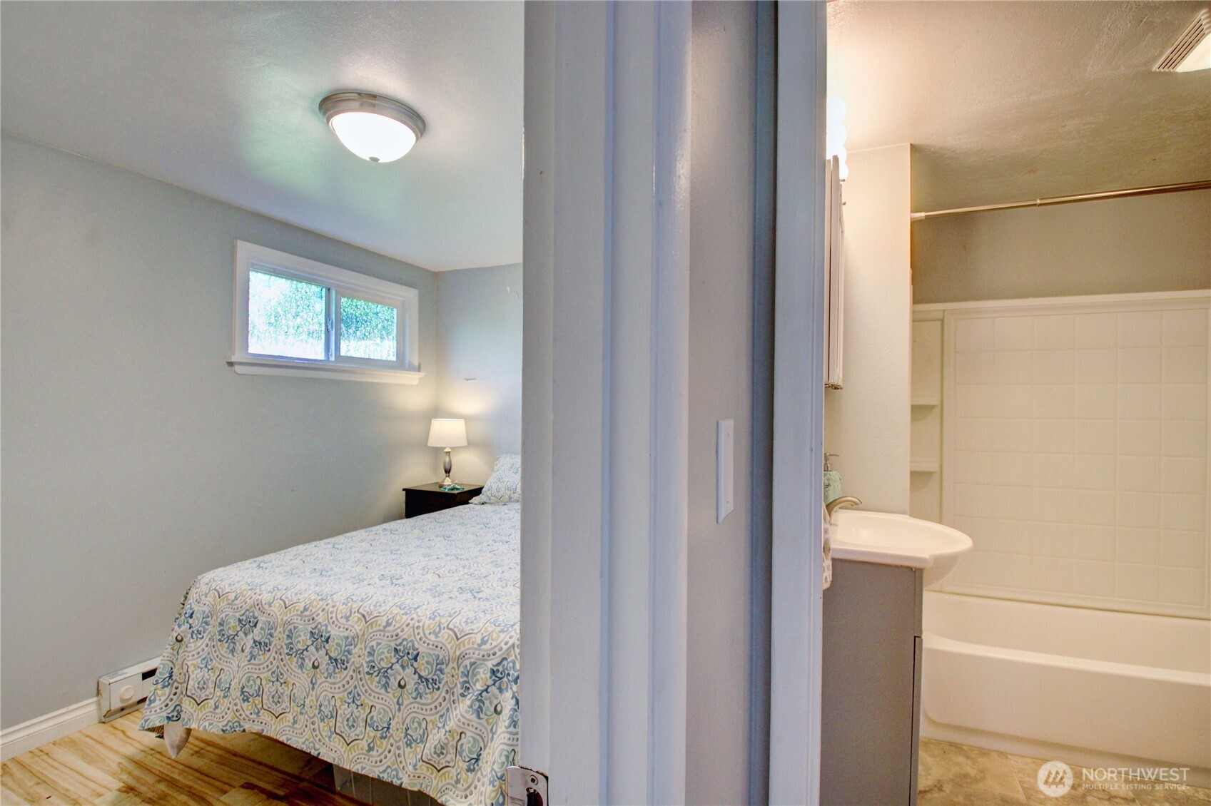 818 Serene View Road Camano Island, WA 98282 - Photo 24 of 39 a bedroom with a bed and a window