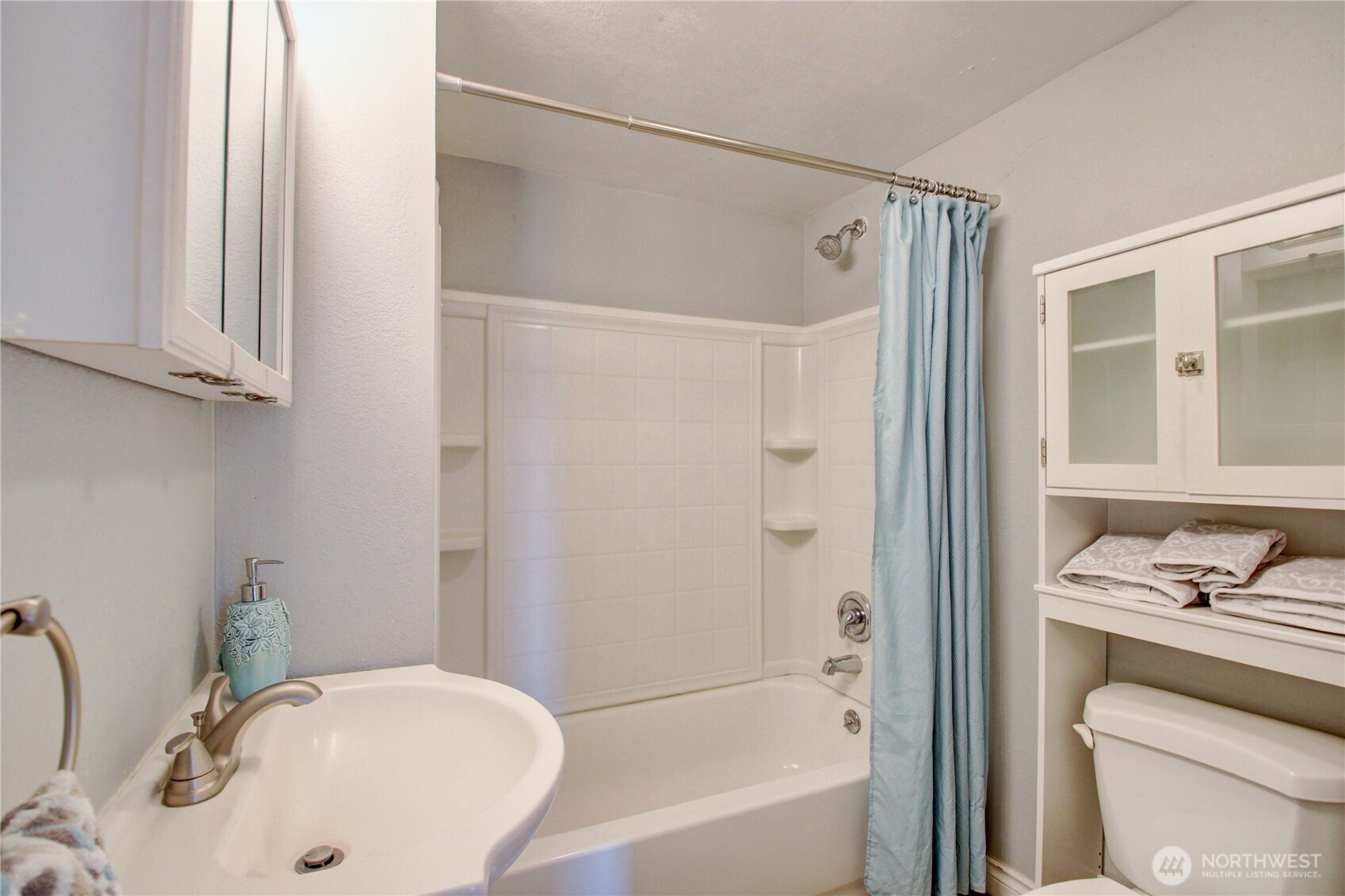 818 Serene View Road Camano Island, WA 98282 - Photo 25 of 39 a bathroom with a sink and a mirror