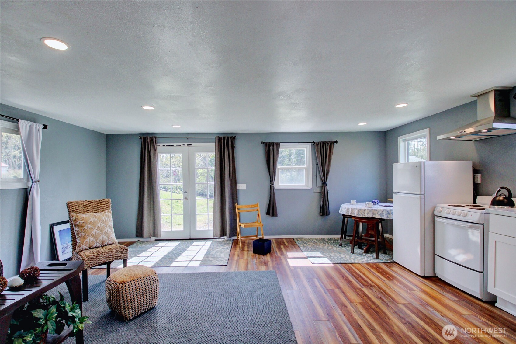 818 Serene View Road Camano Island, WA 98282 - Photo 33 of 39 a living room with furniture and a window