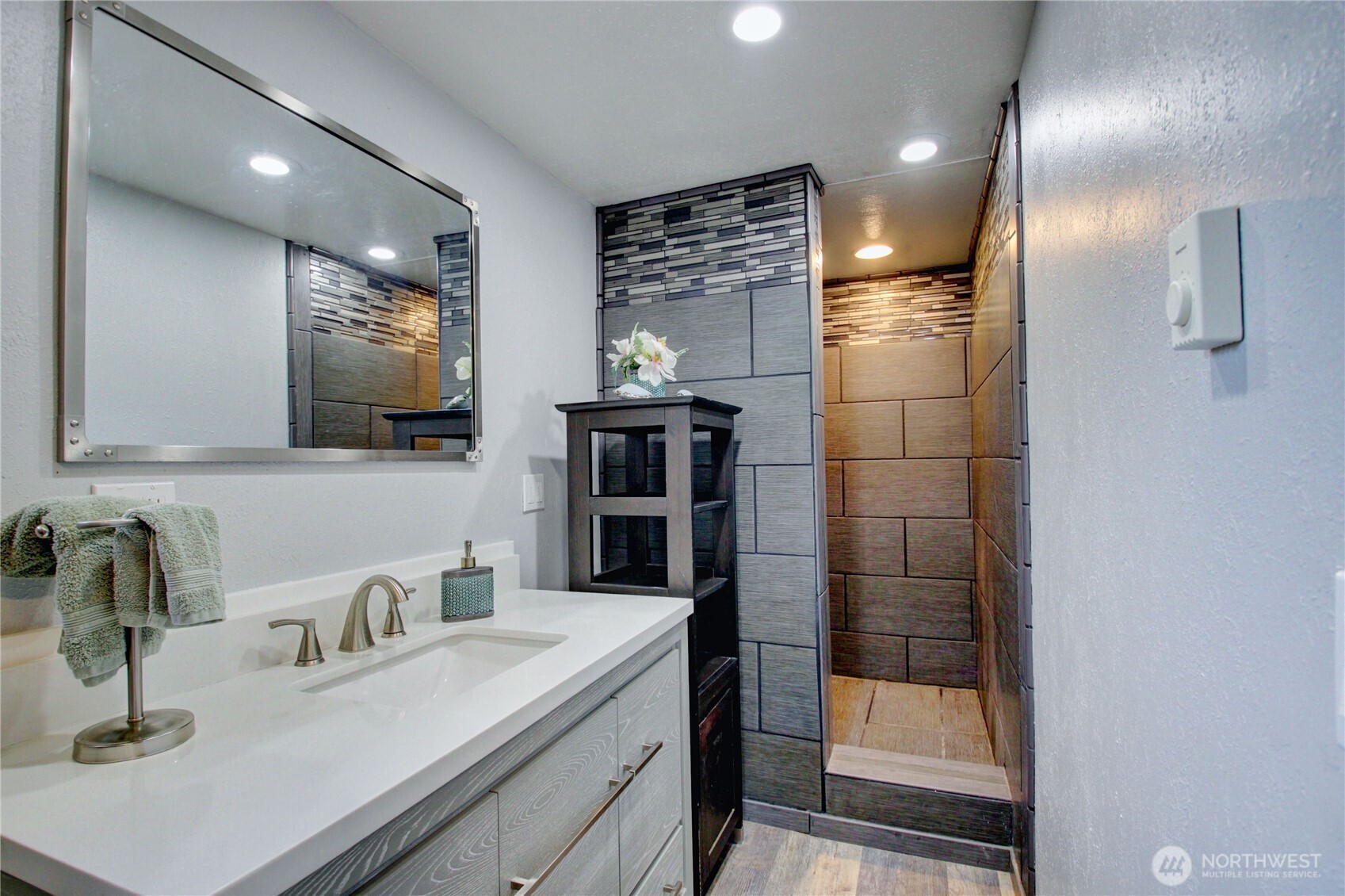 818 Serene View Road Camano Island, WA 98282 - Photo 35 of 39 a bathroom with a sink a shower and a mirror