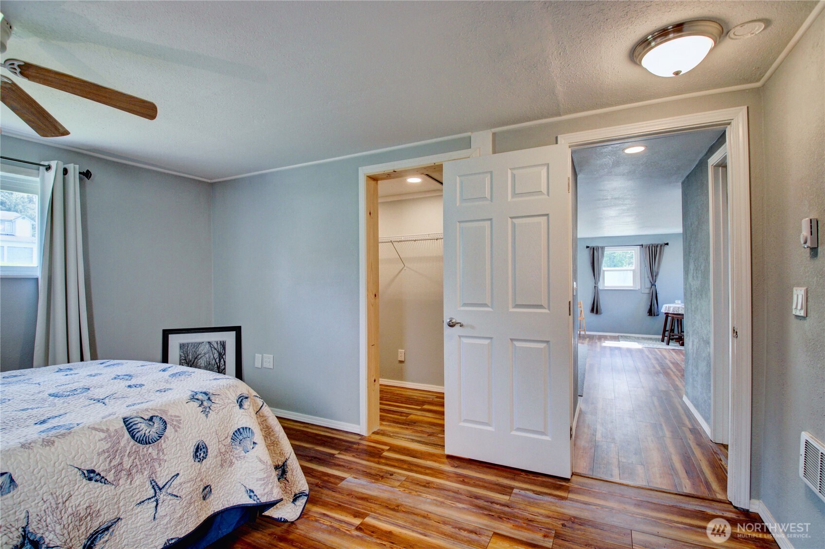 818 Serene View Road Camano Island, WA 98282 - Photo 37 of 39 a bedroom with a bed and wooden floor