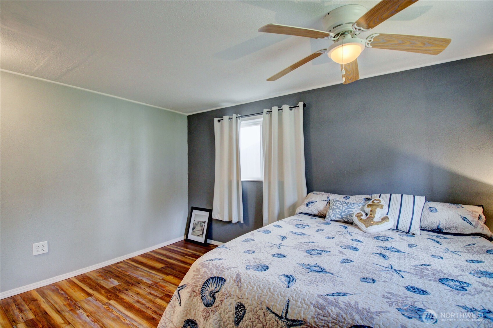 818 Serene View Road Camano Island, WA 98282 - Photo 38 of 39 a bedroom with a bed and a window