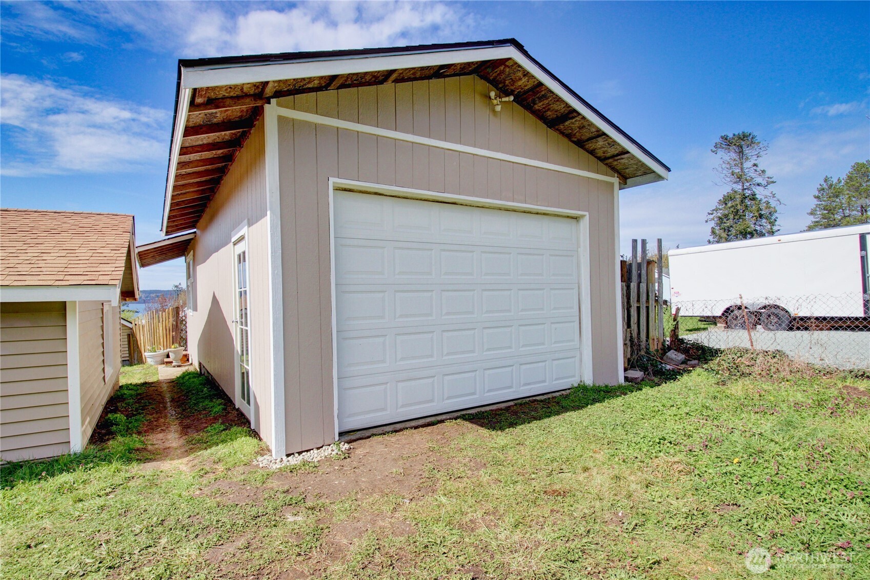 818 Serene View Road Camano Island, WA 98282 - Photo 4 of 39 a view of small house with a yard
