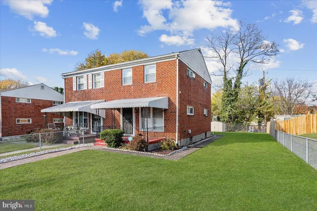 a view of a house with a yard porch and sitting area