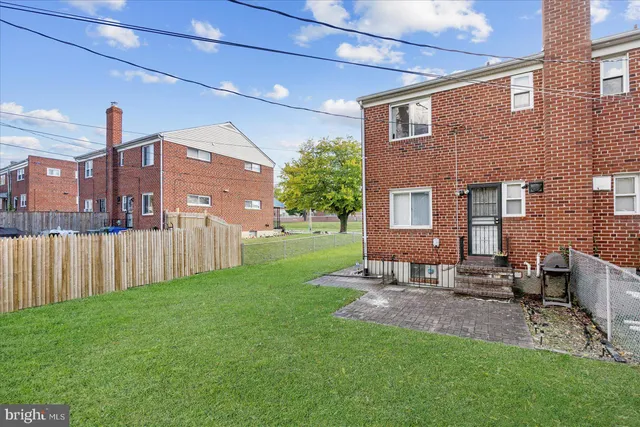 a house view with a sitting space and garden