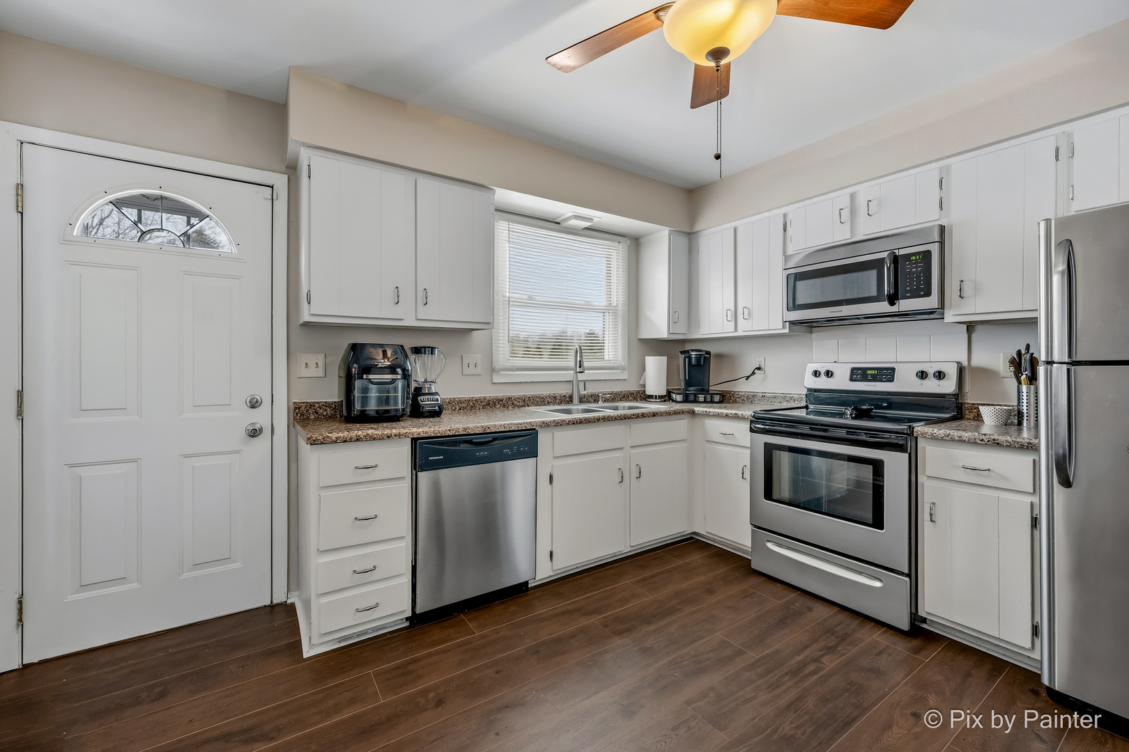 730 Chestnut Court Algonquin, IL 60102 - Photo 22 of 36 a kitchen with stainless steel appliances granite countertop a stove a sink and a microwave