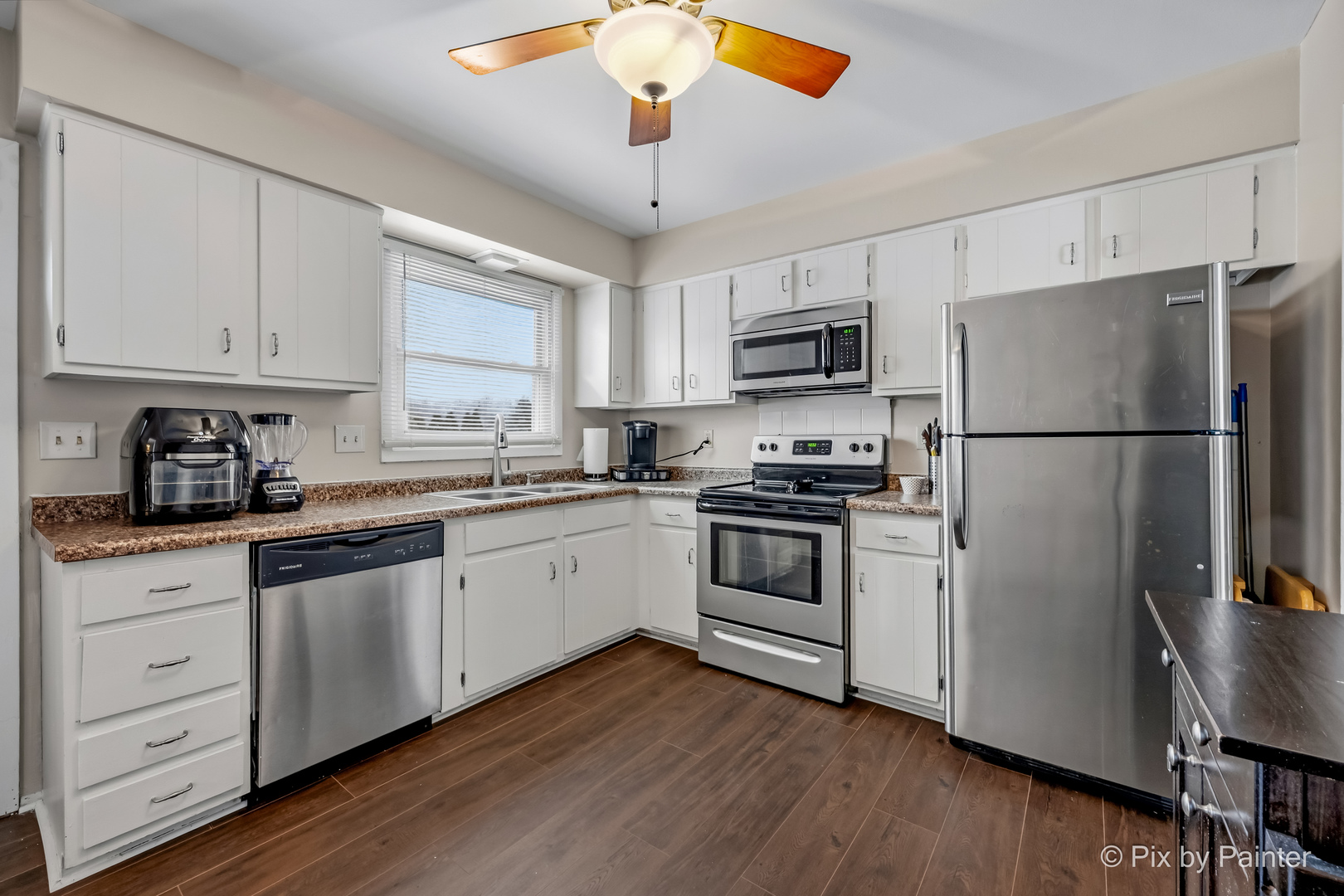 730 Chestnut Court Algonquin, IL 60102 - Photo 23 of 36 a kitchen with a refrigerator stove and white cabinets