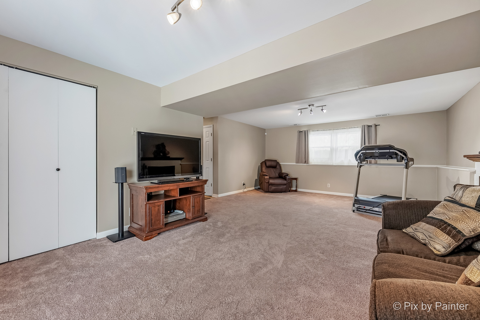 730 Chestnut Court Algonquin, IL 60102 - Photo 34 of 36 a living room with furniture and a flat screen tv