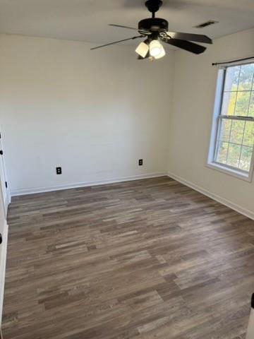 39 North Ridge Drive Northwest Adairsville, GA 30103 - Photo 15 of 25 an empty room with wooden floor chandelier fan and windows